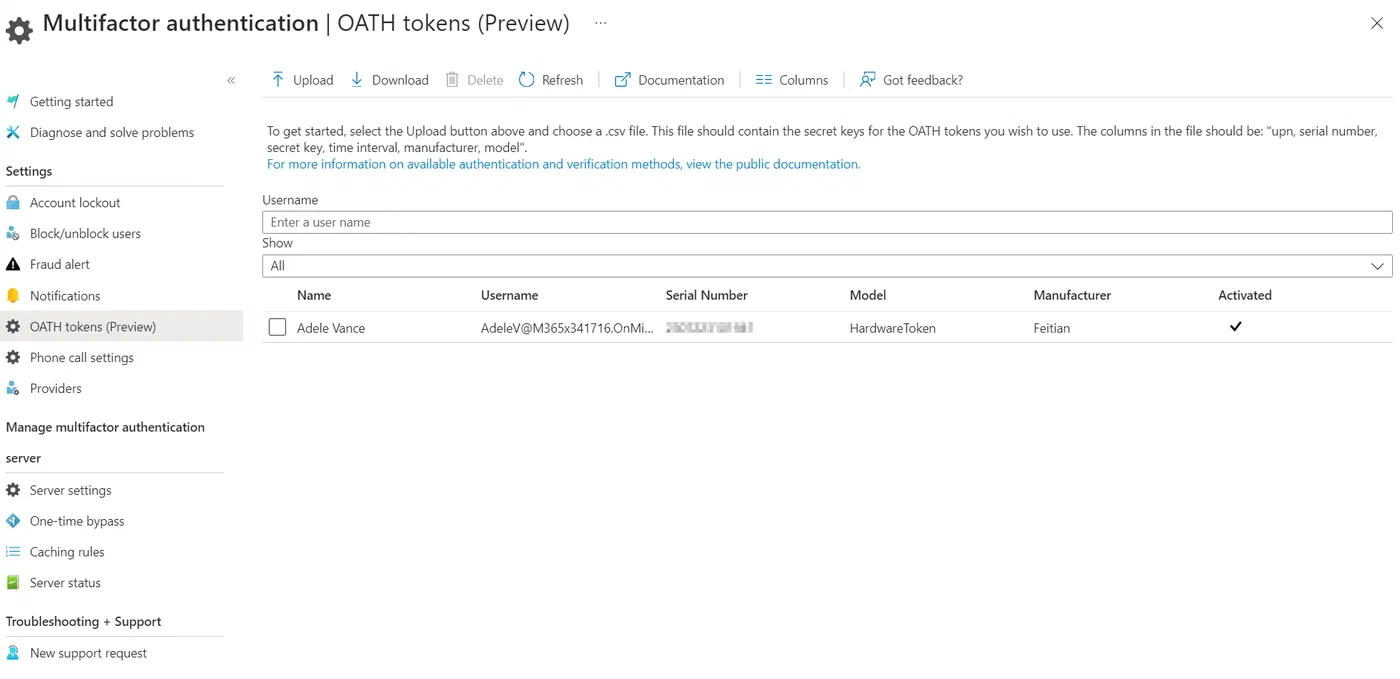 Entra admin center listing the registered hardware OATH token